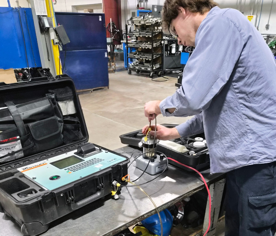 Technician analyzing a hydraulic oil sample